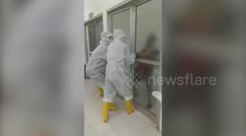 Terrifying moment furious coronavirus patient breaks out of isolation ward in Indonesia