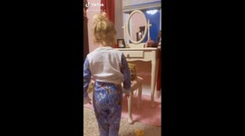 'He looks beautiful!' Two-year-old Lily pampers her purr-fect cat