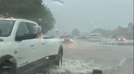 Traffic driving through floods on busy Oklahoma streets