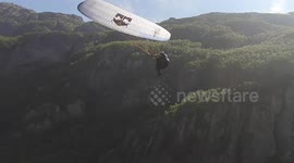Vertigo-inducing footage shows daredevil performing front flips while paragliding in Norway