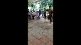 Vietnamese men dancing and eating the fire