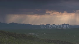Homes in Plains, Rain on Mountains