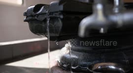 Cleansing Hands and Mala in Fountain Spout