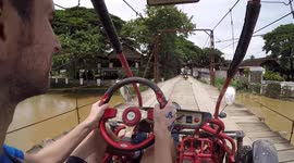 Riding a buggy car through Laos to a stunning waterfall in Vang vieng