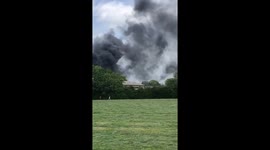 Fire at UK industrial estate sees thick smoke clouds billow into air