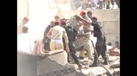 Rescuers sift through burning wreckage of Karachi plane