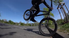 Cool BMX professional Athlete performs amazing trick on his BMX Bike