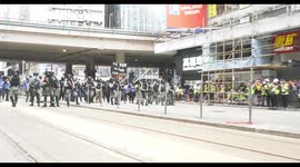 Riot police shoot tear gas too short on Hennessy road