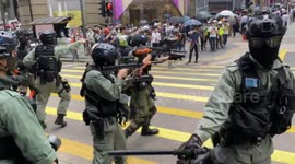 Hong Kong police shoot pepper spray projectiles at protesters