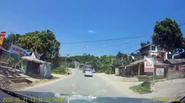 Overtaking lorry causes oncoming driver to swerve and topple over