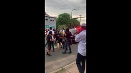 Protesters attempt to stop police vehicle from driving towards crowd during George Floyd protest in Minneapolis