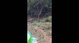 Curious elephant opens iron gate to inspect water purification plant