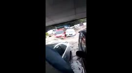 Vehicles submerged and swept along street in El Salvador as Tropical Storm Amanda strikes
