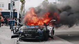 Police car burns in Los Angeles amid George Floyd protesting