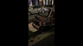 Charred police vehicle on street of New York City after night of violence