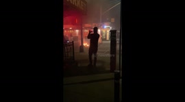Trash can fire in Soho during riots