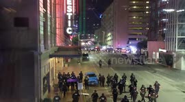 Dallas police march on protesters armed with riot gear and tear gas