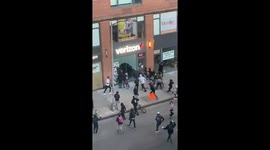 Moment looters descend upon BMW and Verizon store in New York City