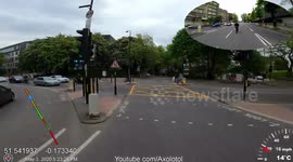 Black BMW does a dangerous close pass to a man on a bicycle and honks horn to give a fright 4K UHD