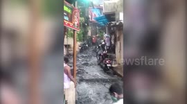 Overflowing sewage floods street as Cyclone Nisarga approaches India's west coast