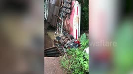 Chinese petrol tanker falls 40ft into river when bridge collapses in Laos