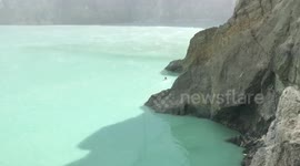 Heartbroken best friend swims through acidic volcanic crater after colleague was killed by tsunami