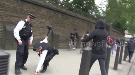 Black Lives Matter protesters throw water bottles at police during London march