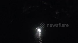 Look away if you're claustrophobic! US Kayaker takes on terrifyingly small abandoned mining tunnel