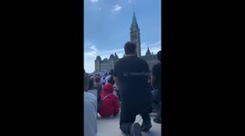 'You can hear a pin drop': Powerful moment Canadian protesters kneel in silence in Ottawa for George Floyd