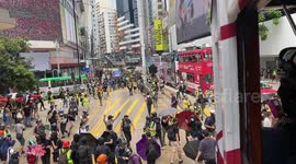 Police moving forward after firing tear gas at the Anti-National Security Law protest in Hong Kong on 24 May 2020