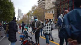 Young black family at BLM protest, Melbourne
