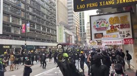 Protestors retreated after police fired blue dyed water from water cannon on 20 October 2019