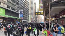Protestors retreated after police fired blue dyed water from water cannon at the Anti-Extradition Bill protest on 20 October 2019