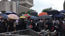 Protestors gearing up and passing umbrellas to the frontline protestors at the Anti-Extradition Bill protest on 12 June 2019