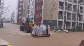 Forklifts used to transport students and deliver food at flooded university in China