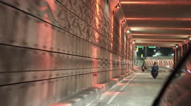 Driving In The Golden Triangle of Jakarta at Night With Many Cyclists On The Road