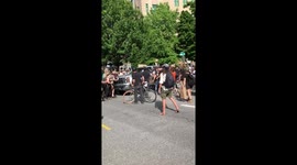 Driver dangerously drives through protest crowd