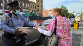 NYPD hand out hand sanitizer and masks to residents in Brooklyn