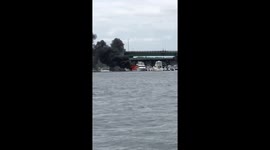 Boat on fire in Massachusetts harbor