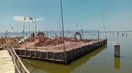 Hundred-year-old Buddhist temple emerges after drought lowers water level in Thai dam