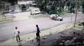 Moment biker is catapulted into the air in head-on crash and lands on his feet