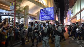 Riot police and protesters continue clashes in Hong Kong