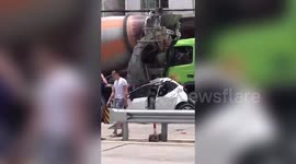 Chinese motorists miraculously survive after their vehicle is crushed in between two trucks