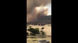 Large plume of smoke rises over Shell Beach, California as Avila fire almost fully contained