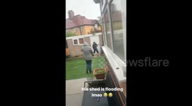 UK man hilariously tries to broom away water from shed as storm floods northern England