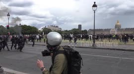 Protesters and police clash in Paris with injured falling on both sides from chaos