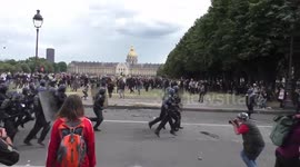 Protesters and police clash in Paris with injured falling on both sides from chaos