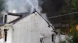 Triple home fire with rescue