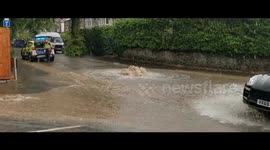 Manhole cover bursts during flashfloodsin Cheltenham