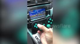 US student uses tech to play Mario and Sonic through car radio screen